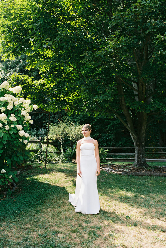 Bride approaching the groom during her first look taken on film wedding photography.