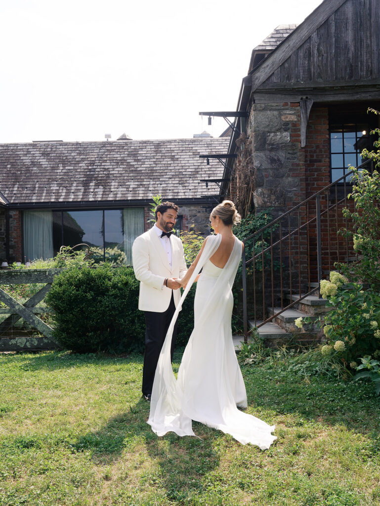 Groom sees the bride for the first time with surprise.