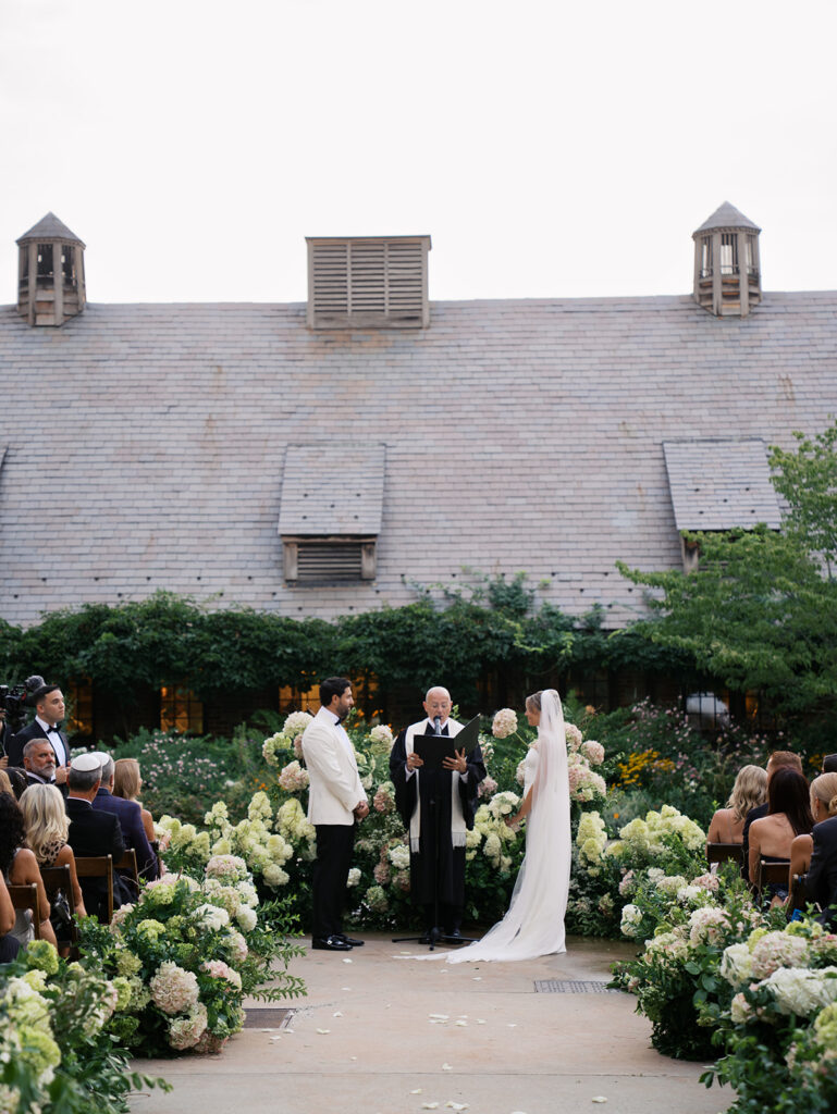 A ceremony aisle photo of this Blue Hill at Stone Barns Wedding.