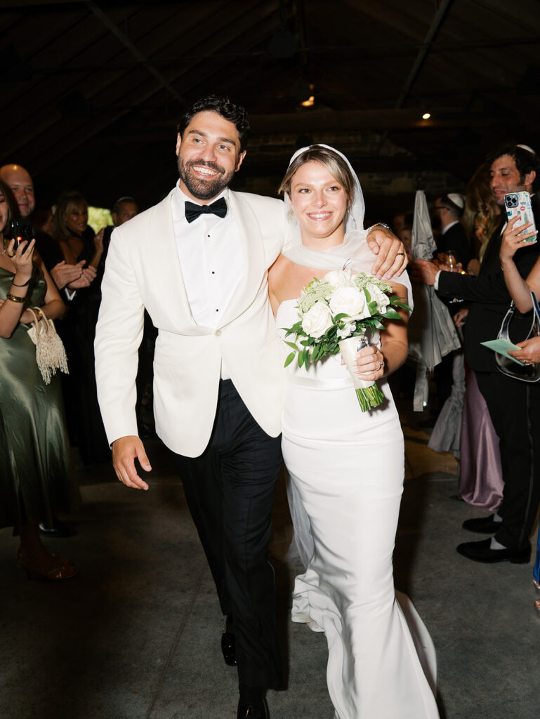 The bride and groom recessing during their Blue Hill at Stone Barns Wedding.