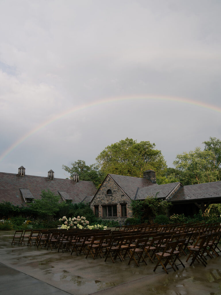 A rainbow comes out over the ceremony at this Blue Hill at Stone Barns Wedding.