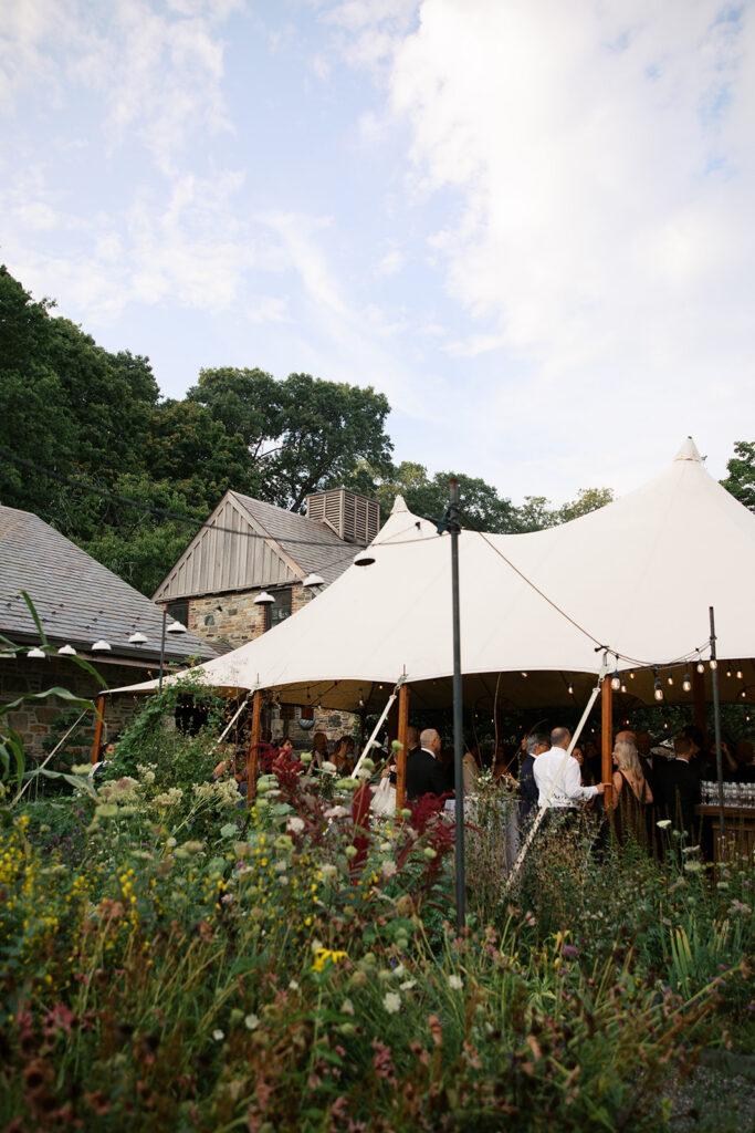 The cocktail hour tent from a pulled back view.